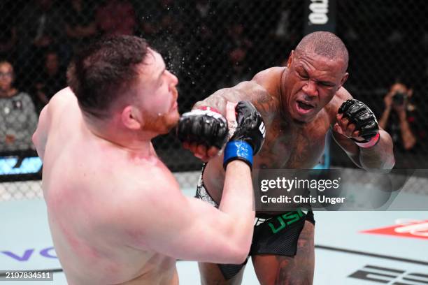 Mohammed Usman of Nigeria punches Mick Parkin of England in a heavyweight fight during the UFC Fight Night event at UFC APEX on March 23, 2024 in Las...