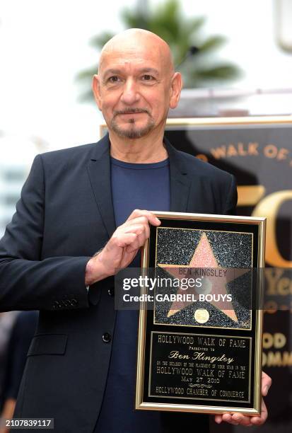 British actor Ben Kingsley poses after being honored by a Star on the Hollywood Walk of Fame, on May 27, 2010 in Hollywood, California. AFP PHOTO /...