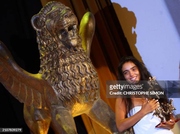 French actress Hafsia Herzi poses with her Marcello Mastroianni prize during the closing ceremony of the 64th Venice International Film Festival at...
