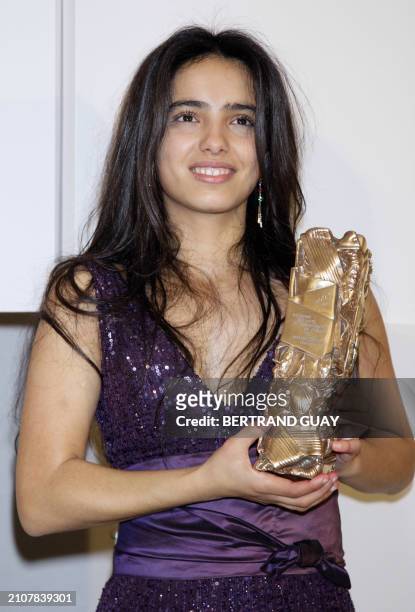 Tunisian actress Hafsia Herzi poses after receiving the Best newcomer actress award during the 33rd Nuit des Cesar, France's top movie awards, on...
