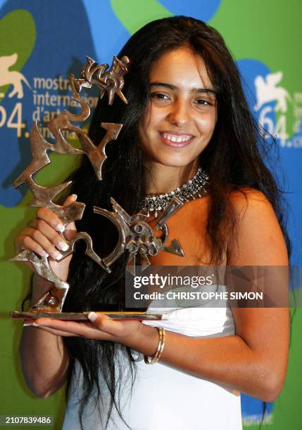 French actress Hafsia Herzi poses with her Marcello Mastroianni prize after the closing ceremony of the 64th Venice International Film Festival at...