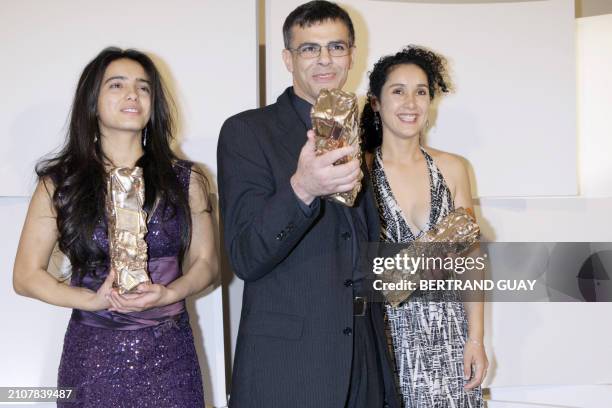 Franco-Tunisian director Abdellatif Kechiche poses with his Best director award and Tunisian actress Hafsia Herzi , during the 33rd Nuit des Cesar,...