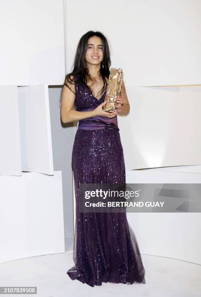 Tunisian actress Hafsia Herzi poses after receiving the Best newcomer actress award during the 33rd Nuit des Cesar, France's top movie awards, on...