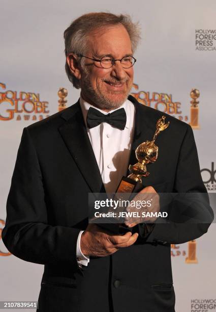 Director Steven Spielberg, recipient of the Cecil B. DeMille Award for Outstanding Contribution to the Entertainment Field, poses with his award in...