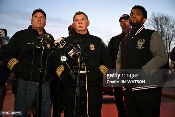 Baltimore Police Commissioner Richard Worley, with Mayor Brandon Scott and Fire Department Chief James Wallace , speaks at a press conference on the...