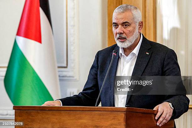 Ismail Haniyeh, the Doha-based political bureau chief of the Palestinian Islamist movement Hamas, speaks to the press after a meeting with the...