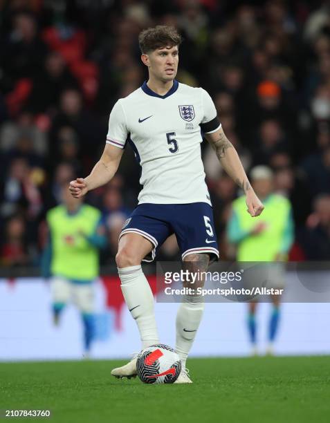 John Stones of England passing the ball during the international friendly match between England and Brazil at Wembley Stadium on March 23, 2024 in...