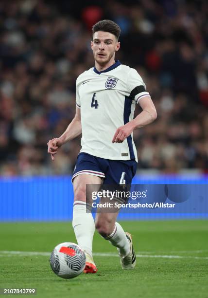 Declan Rice of England passing the ball during the international friendly match between England and Brazil at Wembley Stadium on March 23, 2024 in...