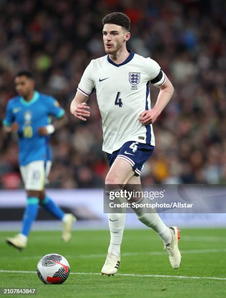 Declan Rice of England on the ball during the international friendly match between England and Brazil at Wembley Stadium on March 23, 2024 in London,...