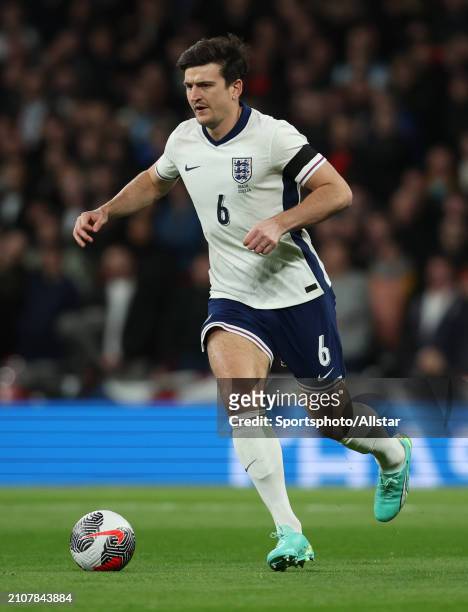 Harry Maguire of England on the ball during the international friendly match between England and Brazil at Wembley Stadium on March 23, 2024 in...