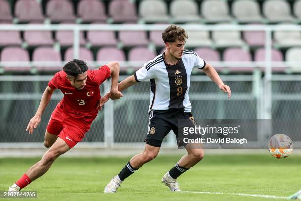 Berkay Ylmaz of Turkiye and Luca Marino of Germany in action during the UEFA Under19 European Championship Qualifier match between Türkiye and...
