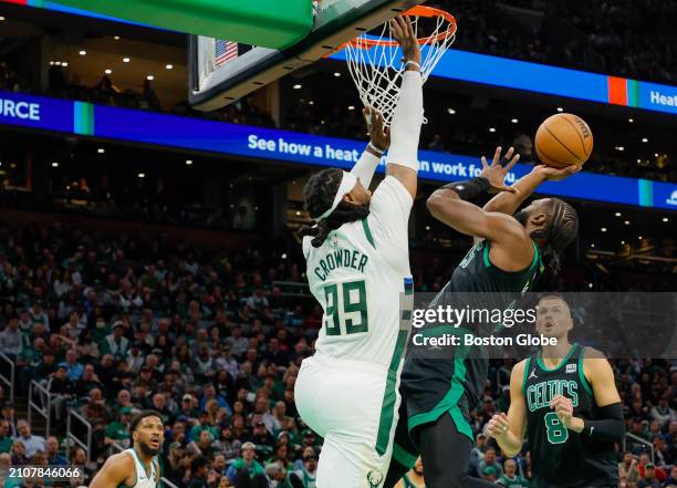 Boston, MA Boston Celtics guard Jaylen Brown scores with pressure from Milwaukee Bucks forward Jae Crowder in the first quarter. The Celtics beat the...