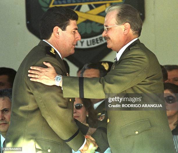 The new General of National Exercises, Javier Carrion , greets the General projection, Joaquin Caudra during the act of change of hand in a military...