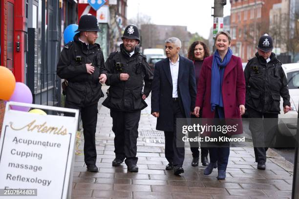 London Mayor Sadiq Khan and Shadow Home Secretary Yvette Cooper walk and speak with police officers in Earlsfield on March 26, 2024 in London,...