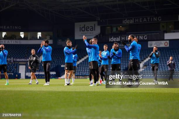 Jed Wallace of West Bromwich Albion leads the team in applauding the fans during an open training session at The Hawthorns on March 26, 2024 in West...