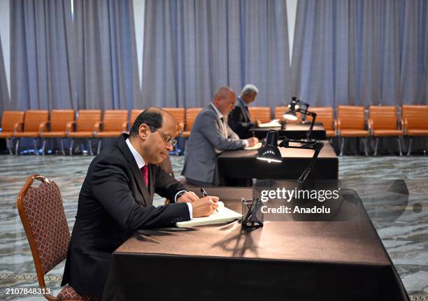 People sign the book of condolences the Russian Embassy to commemorate the people who were killed during the terrorist attack at Moscow Crocus City...