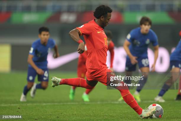 Fei Nanduo of China scores from the penalty spot during the 2026 FIFA World Cup Qualifier between China and Singapore at Tianjin Olympic Centre...