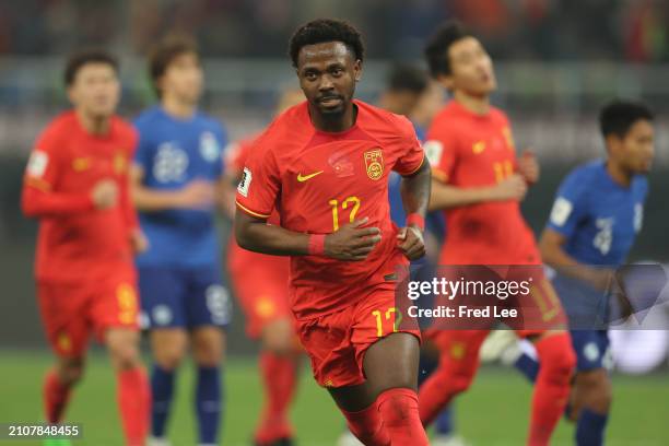 Fei Nanduo of China celebrates his first goal during the 2026 FIFA World Cup Qualifier between China and Singapore at Tianjin Olympic Centre Stadium...