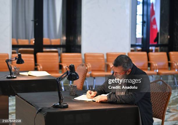 People sign the book of condolences the Russian Embassy to commemorate the people who were killed during the terrorist attack at Moscow Crocus City...