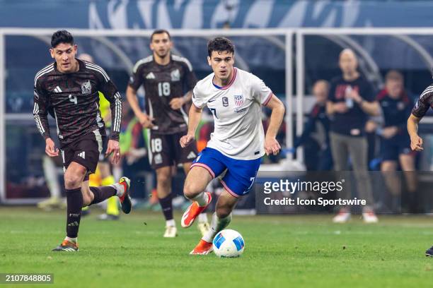 United States forward Gio Reyna dribbles up field during the Concacaf Nations League Final match between Mexico and the United States on March 24,...