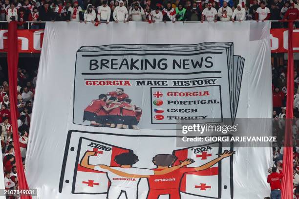 Georgia fans with a banner during the UEFA EURO 2024 qualifying play-off final football match between Georgia and Greece in Tbilisi on March 26, 2024.