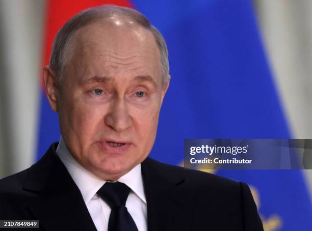 Russian President Vladimir Putin speaks during an annual expanded Prosecutor General's Office meeting, March 26 in Moscow, Russia. Dozens people were...