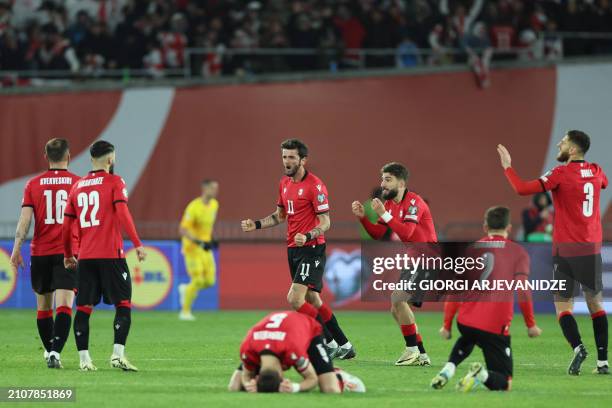 Georgia's players react during the penalty shoot-out during the UEFA EURO 2024 qualifying play-off final football match between Georgia and Greece in...