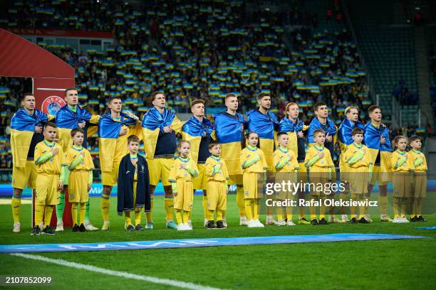 Ukraine players line up for the national anthem prior to the UEFA EURO 2024 Play-Offs final match between Ukraine and Iceland at Tarczynski Arena on...