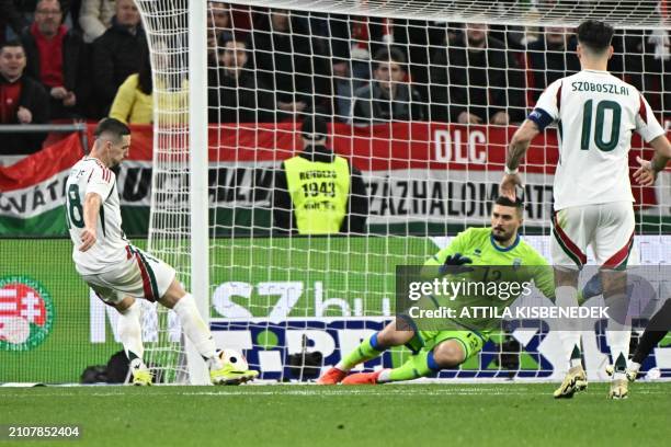 Hungary's midfielder Zsolt Nagy scores past Kosovo's goalkeeper Arijanet Muric during the friendly football match between Hungary and Kosovo in the...