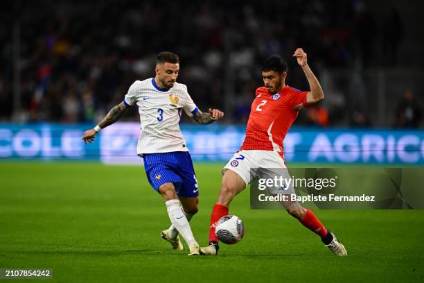 Jonathan CLAUSS of France and Gabriel SUAZO of Chile during the friendly match between France and Chile at Orange Velodrome on March 26, 2024 in...