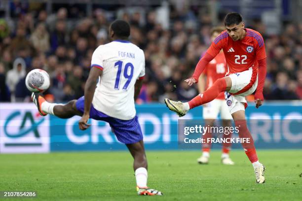 Chile's forward Dario Osorio shoots the ball past France's midfielder Youssouf Fofana during the friendly football match between France and Chile at...