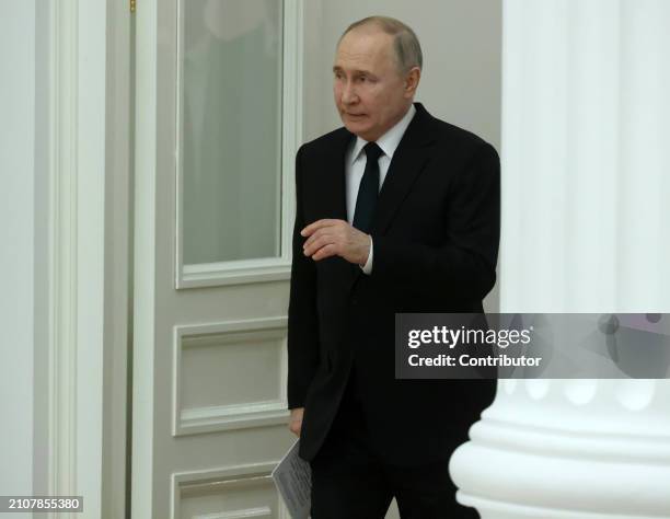 Russian President Vladimir Putin enters the hall during the ceremony of State Awards for Youth Culture Professionals, on March 26, 2024 in Moscow,...