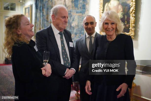 Author Amanda MacKenzie, British writter Gyles Brandreth, Aatif Hassan and Britain's Queen Camilla attend a reception to mark the findings of a new...