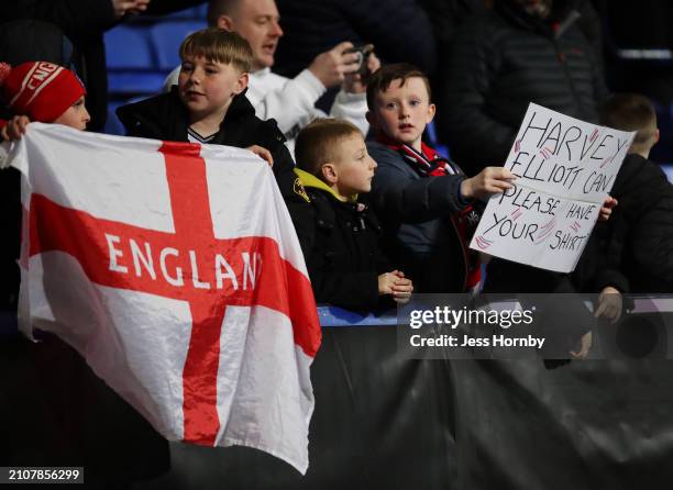 An England fan holds up a sign reading 'Harvey Elliott can I please have your shirt' following the UEFA U21 Euro 2025 Qualifier between England and...