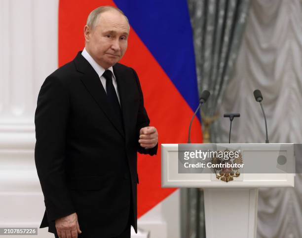 Russian President Vladimir Putin grimases during the ceremony of State Awards for Youth Culture Professionalson March 26, 2024 in Moscow, Russia....