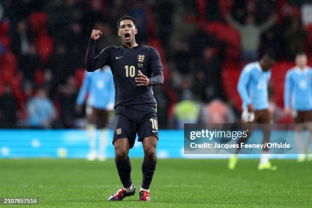 Jude Bellingham of England celebrates after scoring the late equalising goal during the international friendly match between England and Belgium at...