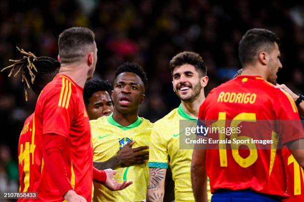 Vinícius Júnior and Lucas Beraldo of Brazil talks to Aymeric Laporte of Spain during the friendly match between Spain and Brazil at Estadio Santiago...