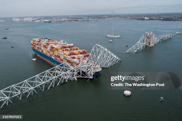 The remains of the Francis Scott Key Bridge on March 26, 2024 in Baltimore. A maintenance team was repairing potholes on the bridge, a vital route...