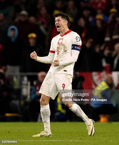 Poland's Robert Lewandowski celebrates scoring in the penalty shoot out during the UEFA Euro 2024 Qualifying play-off final at the Cardiff City...
