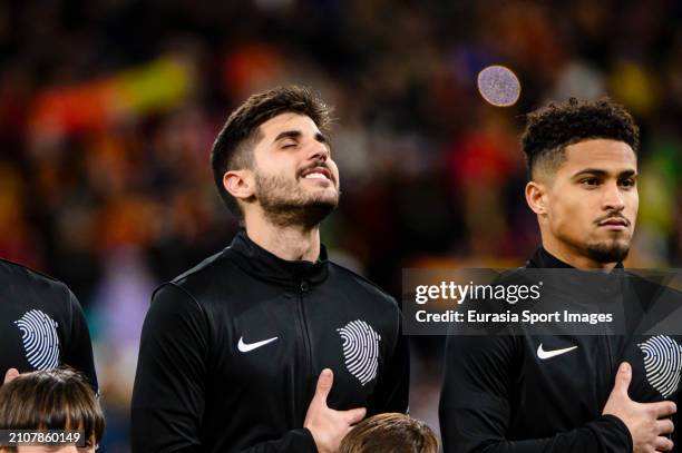 Lucas Beraldo of Brazil sings the National Anthem with his teammates during the friendly match between Spain and Brazil at Estadio Santiago Bernabeu...