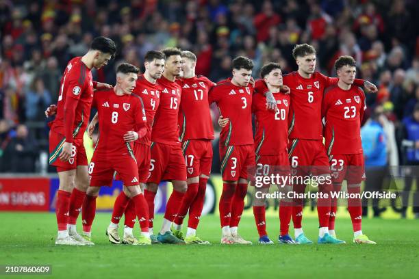 Wales players look dejected as they watch the shootout during the UEFA EURO 2024 Play-Offs Final match between Wales and Poland at Cardiff City...