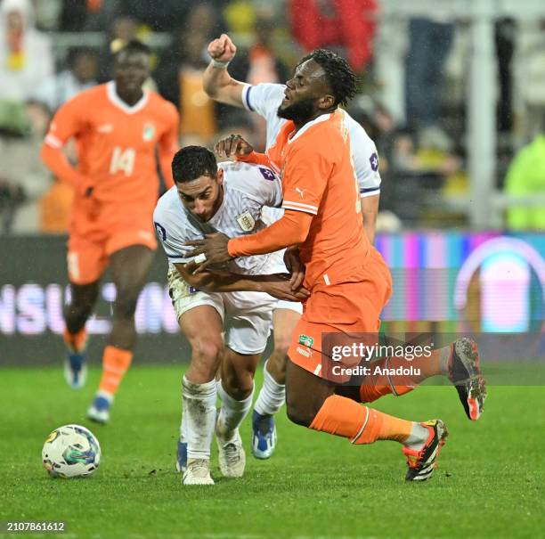 Franck Kessie of Ivory Coast in action against Careers Ramos of Uruguay during the international friendly football match between Ivory Coast and...