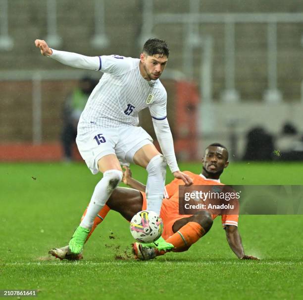 Konan Ghislain of Ivory Coast in action against Valverde Dipetta of Uruguay during the international friendly football match between Ivory Coast and...