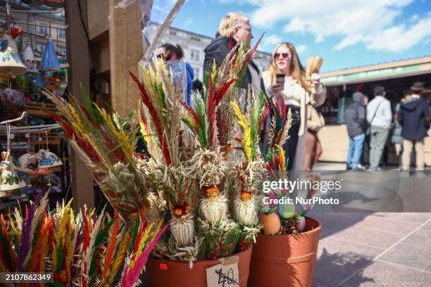 Traditional Easter Market at the Main Square in Krakow, Poland on March 26th, 2024. Colourful Easter eggs, handmade decorations and regional food,...