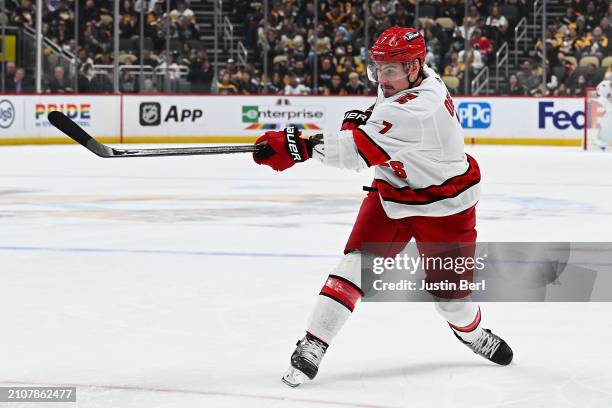 Dmitry Orlov of the Carolina Hurricanes scores a goal in the second period during the game against the Pittsburgh Penguins at PPG PAINTS Arena on...