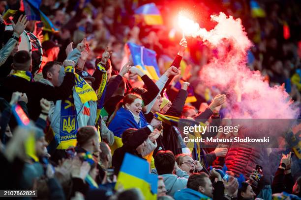 Fans of Ukraine seen on the tribune with flare during the UEFA EURO 2024 Play-Offs final match between Ukraine and Iceland at Tarczynski Arena on...