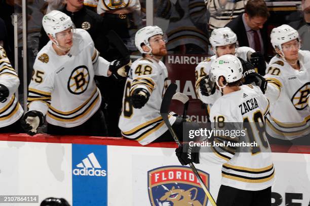 Teammates congratulate Pavel Zacha of the Boston Bruins after he scored the go ahead goal in the third period goal against the Florida Panthers at...