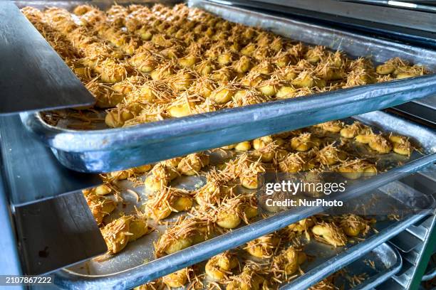 Workers are making cookies at the J&amp;C Cookies factory in Bandung, Indonesia, on March 27, 2024. The cookie manufacturer, J&amp;C Cookies, is...