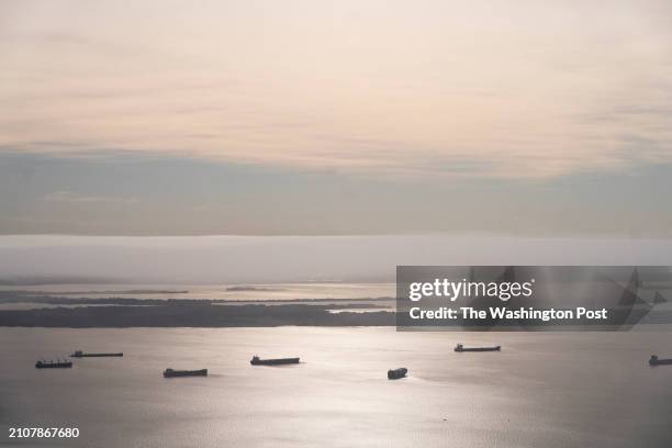 March 26: Container ships wait in the Chesapeake Bay near the scene where a container ship crashed into the Francis Scott Key Bridge in Baltimore, MD...