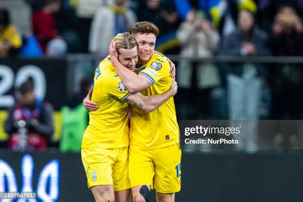 Mykhailo Mudryk and Viktor Tsygankov are celebrating after scoring a goal for Ukraine during the UEFA EURO 2024 Play-Offs final match between Ukraine...